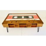 LOW TABLE, 40cm high x 110cm wide x 60cm deep, cassette tape design, with storage to one side.