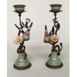 CANDLESTICKS, a pair, Continental style painted porcelain and gilt metal mounted modelled as finches