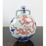 DRAGON MOONFLASK VASE, with a red dragon chasing the flaming pearl of wisdom a mist blue sea and