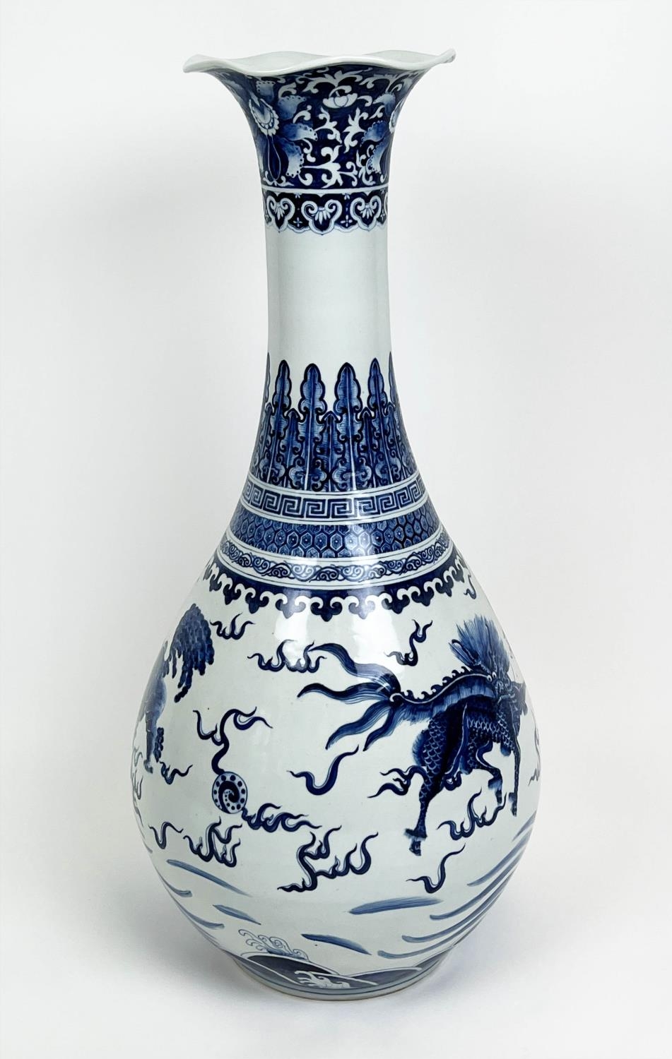 CHINESE BOTTLE VASE, Kangxi style, decorated with a Buddhist lions and deer with shaped lip, 79cm H.