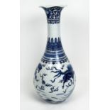 CHINESE BOTTLE VASE, Kangxi style, decorated with a Buddhist lions and deer with shaped lip, 79cm H.