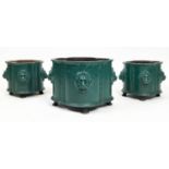 LION HEAD PLANTERS, a set of three, 19th century English green painted cast iron, largest 31cm H x