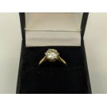 AN 18CT GOLD DIAMOND SOLITAIRE RING, platinum gallery setting, the brilliant cut stone of