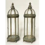 STORM LANTERNS, a pair, glazed and verdigris pierced metal framed with handle, 90cm H. (2)