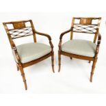 ARMCHAIRS, a pair, Regency design walnut with tablet and lattice backs and cane seats (with