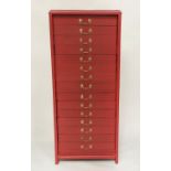 BANK OF DRAWERS, early 20th century cardinal red painted with fifteen drawers and brass handles,