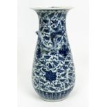 CHINESE BLUE AND WHITE WHITE YUAN STYLE VASE, adorned with under glaze scrolling foliate pattern and