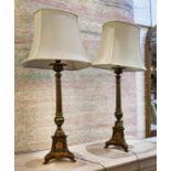 BRASS LAMPS, a pair, bases each 66cm tall, with triform bases detail, with shades. (2)