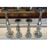 CANDLESTICKS, two graduated pairs, 46cm H at tallest, eglomise style glazed finish ceramic. (4)