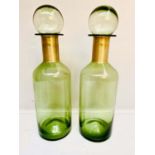 MURANO STYLE GLASS DECANTERS, 52cm H x 15cm diam, a pair, with gilt collars. (2)