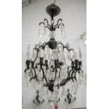 CHANDELIER, approx 75cm H x 50cm W, patinated metal and glass with four lights.