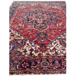 ANTIQUE PERSIAN HERIZ CARPET, 310cm x 245cm.