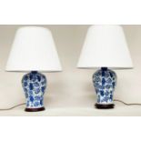 TABLE LAMPS, a pair, Chinese blue and white ceramic vase form with wooden bases and shades, 57cm