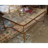 OKA TABLE, 121cm W x 88cm x 52cm H, glass top, on a Champagne gilt metal base.