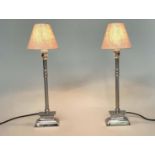 CANDLESTICK TABLE LAMPS, Italian style chromium metal with stepped plinths and shades columns,