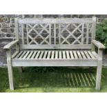 GARDEN BENCH BY NEPTUNE, weathered teak with lattice back and flat arms, 120cm W.
