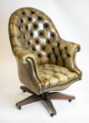 DESK CHAIR, 102cm H x 79cm W, tan leather with revolving and reclining seat.