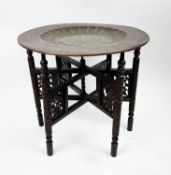 BENARES TABLE, round brass inlaid scalloped interior with anthemion and foliate decorated detail