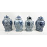 CHINESE BALUSTER VASES, four, blue and white decorated with lids, 45cm H. (4)