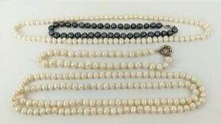 FOUR FRESHWATER PEARL NECKLACES, comprising three white pearl necklaces and one peacock pearl