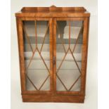 ART DECO DISPLAY CABINET, walnut with two glazed doors enclosing shelves, 90cm x 130cm H x 31cm D.