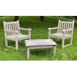 GARDEN ARMCHAIRS AND TABLE, a pair, weathered teak of slatted and pegged construction, 61cm W