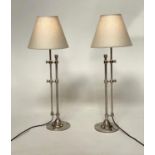 TABLE LAMPS BY INDIA JANE, a pair, chromed metal twin column, height adjustable with shades, max