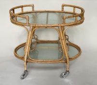 CANE TROLLEY/TABLE, 1950s style rattan and cane bound, two tier and glazed.