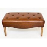 HALL BENCH, brass studded tan leather upholstered with bowed under tier, 100cm W x 45cm D x 50cm H.