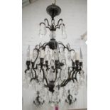 CHANDELIER, approx 75cm H x 50cm W, patinated metal and glass with four lights and a set of three