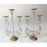 CANDELABRA, a pair, distressed metal each with three branches, 55cm H. (2)