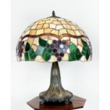 TIFFANY STYLE LAMP, the shade decorated with grapes and vine leaves on an Art Nouveau design base,