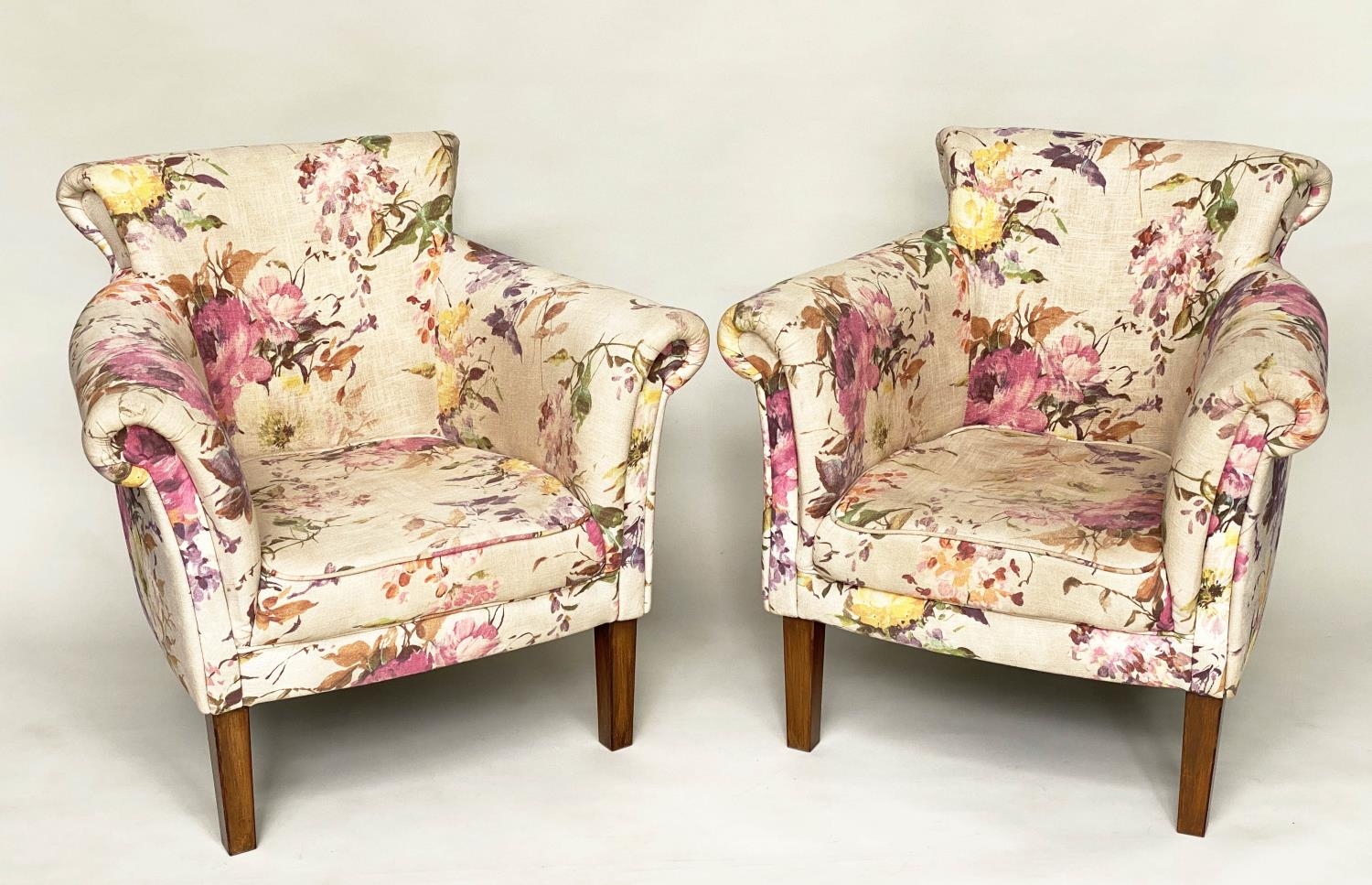 TUB ARMCHAIRS, a pair, with bow backs and Country House style printed linen upholstery and