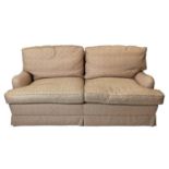 HOWARD STYLE SOFA, three seater, upholstered in coral design fabric, with turned front supports