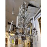 CHANDELIERS, a pair, approx 115cm H x 80cm W, late 19th century, with a silvered wood stem, metal