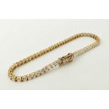 A 14CT GOLD WHITE STONE BRACELET, 16cm long, 6.78 grams.