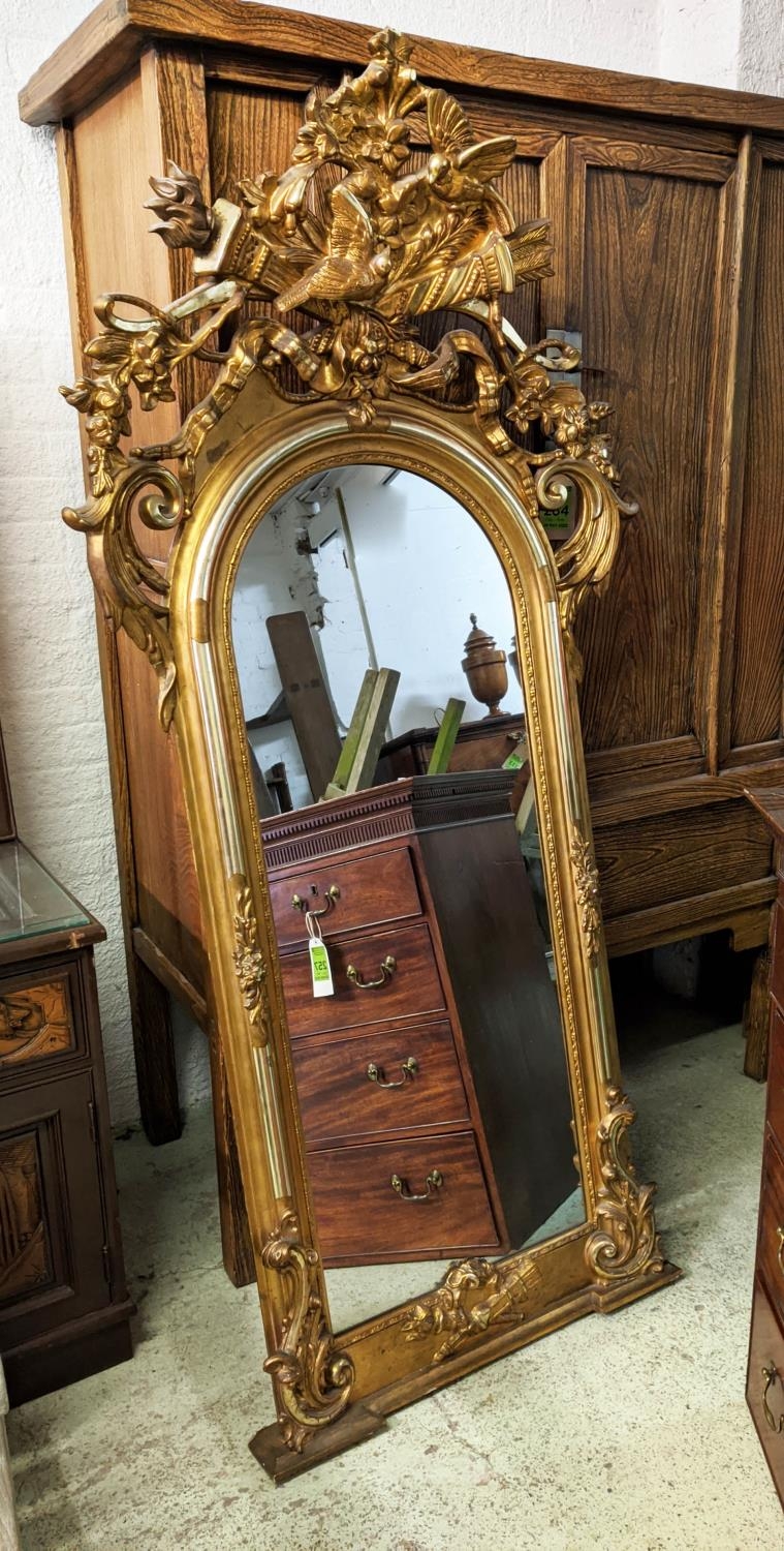 WALL MIRROR, 95cm W x 194cm H mid 19th century Continental giltwood with torch and quiver, bird