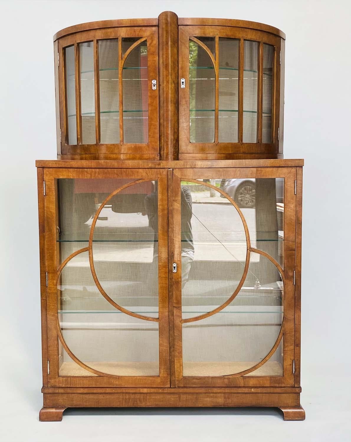 ART DECO DISPLAY CABINET, burr walnut with two bow glazed doors above two further glazed doors,