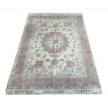 TABRIZ PART SILK RUG, 216cm x 152cm, together qwith a matching circular rug, 155cm diam. (2)