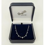 A 14CT WHITE GOLD AND DIAMOND SET NECKLACE, with trefoil diamond set links, 42cm long, complete with