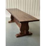YEWWOOD REFECTORY TABLE, 20th century Welsh solid yewwood with three plank top, twin trestles and