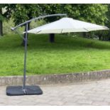 SUN UMBRELLA, circular cream canvas retractable wind up with frame and weights, 300cm W.