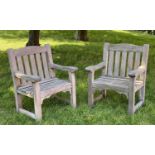 GARDEN ARMCHAIRS, a pair, silvery weathered teak of substantial slatted and pegged construction by
