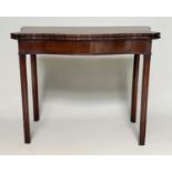 TEA TABLE, George III figured mahogany of serpentine outline, foldover, with channeled square