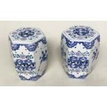 CHINESE STOOLS, a pair, Chinese blue and white ceramic of facetted barrel form with pierced