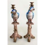 PARROT CANDLESTICKS, a pair, Continental style porcelain with gilt metal mounts, 52cm H. (2)