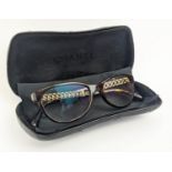 CHANEL LADIES EYEGLASSES, dark tortoise, side with enameled flat curb decoration and iconic CC