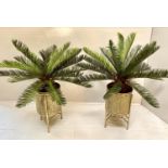 FAUX FERN TREES, a pair, in gilt metal planters, 85cm H in total. (2)