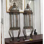 STORM LANTERNS, a pair, on stands coppered metal and glazed, regency style, 92cm H. (2)