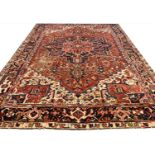 ANTIQUE PERSIAN HERIZ CARPET, 350cm x 255cm.